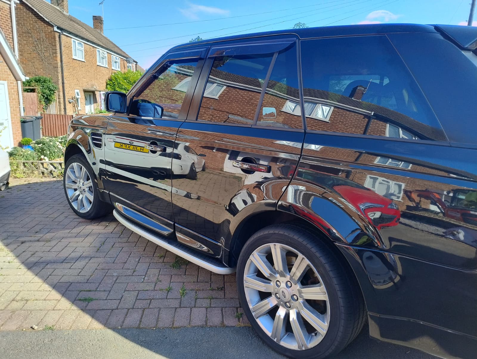 Black Land Rover Discovery gleaming after a premium detail